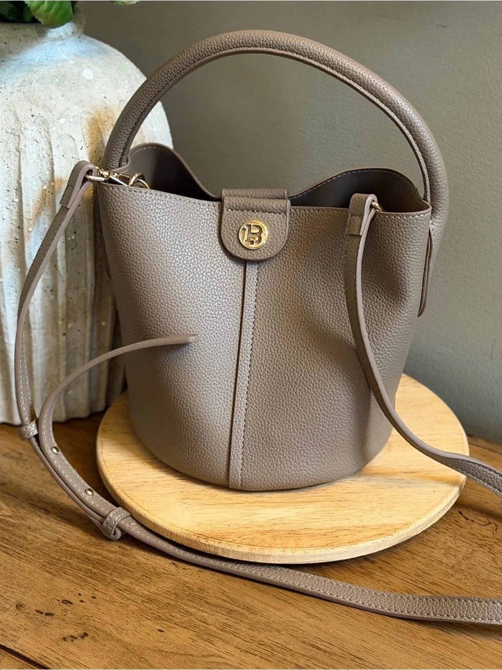 Taupe Leather Bucket Bag with Top Handle and Crossbody Strap